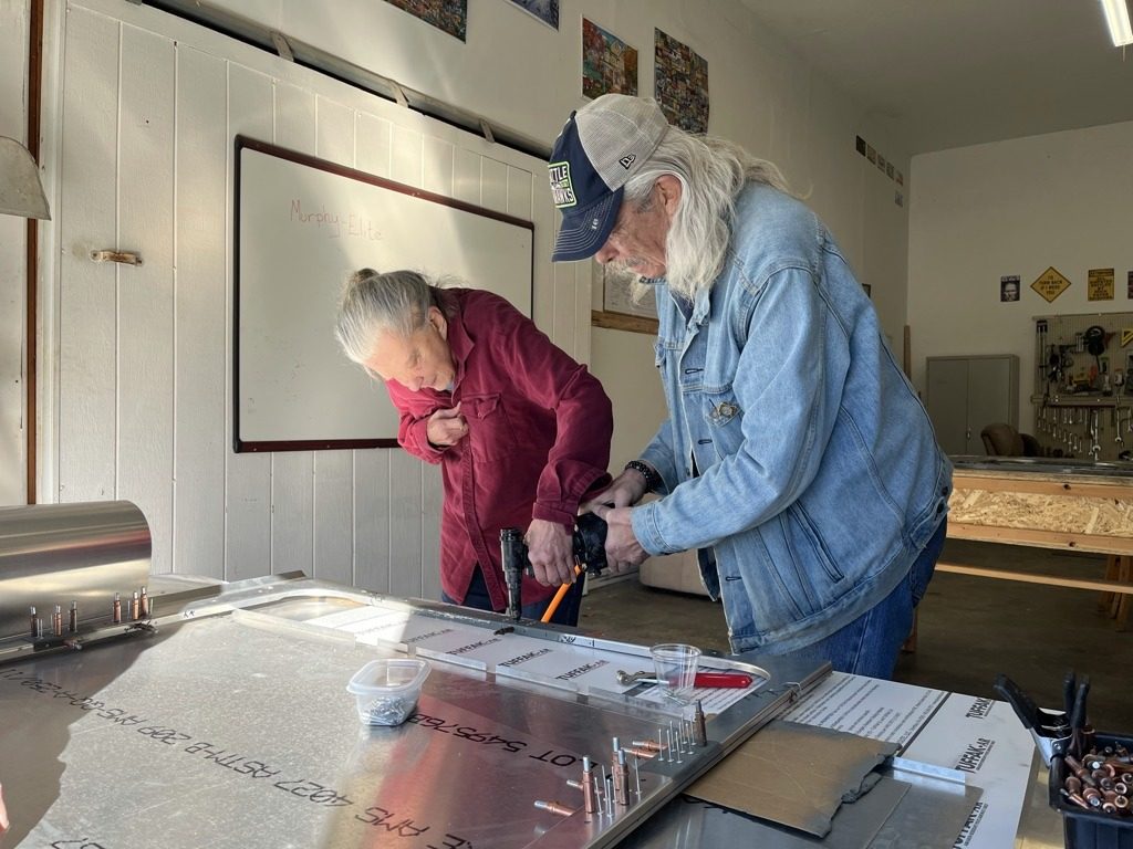 Members working together at a workbench